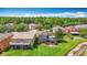 Aerial view of the homes in the community with water view and mature trees at 4207 Fishermans Lake Dr, Lutz, FL 33558
