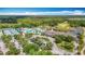 Aerial view of the community clubhouse featuring resort style pool and tennis courts at 4207 Fishermans Lake Dr, Lutz, FL 33558