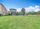 Spacious backyard with screened patio, landscaping and green grass at 4207 Fishermans Lake Dr, Lutz, FL 33558