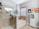 Bright bathroom features a glass shower, soaking tub, and neutral tile at 4207 Fishermans Lake Dr, Lutz, FL 33558