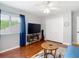 Bedroom with modern gray decor, closet, and dark wood flooring at 4207 Fishermans Lake Dr, Lutz, FL 33558