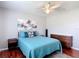 Bedroom with modern gray decor, closet, and dark wood flooring at 4207 Fishermans Lake Dr, Lutz, FL 33558