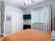 Cozy bedroom with a ceiling fan, window, closet and black dresser at 4207 Fishermans Lake Dr, Lutz, FL 33558