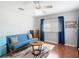Bedroom with contemporary furnishings and dark wood floor at 4207 Fishermans Lake Dr, Lutz, FL 33558