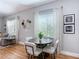 Inviting dining area with modern furnishings and natural light, adjacent to the living space at 4207 Fishermans Lake Dr, Lutz, FL 33558