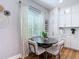 Bright dining area with round table, seating for four, and bright natural light at 4207 Fishermans Lake Dr, Lutz, FL 33558