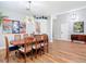Bright dining room features wood floors, modern lighting, and space to host Gathering and friends at 4207 Fishermans Lake Dr, Lutz, FL 33558