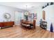 Bright dining room features wood floors, modern lighting, and space to host Gathering and friends at 4207 Fishermans Lake Dr, Lutz, FL 33558