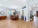 Bright dining room features wood floors, modern lighting, and space to host Gathering and friends at 4207 Fishermans Lake Dr, Lutz, FL 33558