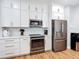 Well-equipped kitchen with stainless steel appliances and ample white cabinetry at 4207 Fishermans Lake Dr, Lutz, FL 33558