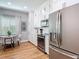 Bright kitchen featuring white cabinets, stainless steel appliances, and an eat-in area near a window at 4207 Fishermans Lake Dr, Lutz, FL 33558
