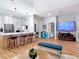 Open concept living area with breakfast bar and modern decor with lots of natural light at 4207 Fishermans Lake Dr, Lutz, FL 33558