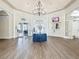 A grand lobby area with a chandelier, elegant decor, and a welcoming atmosphere for residents and guests at 4207 Fishermans Lake Dr, Lutz, FL 33558