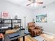 Office space with a comfy leather chair, modern desk, and decorative shelving at 4207 Fishermans Lake Dr, Lutz, FL 33558