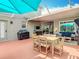 Inviting screened-in patio area with outdoor seating and ample space for gatherings at 4207 Fishermans Lake Dr, Lutz, FL 33558