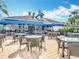 Outdoor patio seating area with comfortable tables and chairs, perfect for relaxing and enjoying the community views at 4207 Fishermans Lake Dr, Lutz, FL 33558