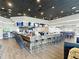 A spacious restaurant area with a large bar, multiple TVs, and plenty of seating for guests at 4207 Fishermans Lake Dr, Lutz, FL 33558