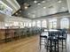 An inviting restaurant area featuring a long bar, comfortable seating, and abundant natural light at 4207 Fishermans Lake Dr, Lutz, FL 33558
