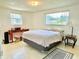 Bright bedroom with a double window and a desk area, offering a serene space at 4333 Baden Dr, Holiday, FL 34691