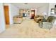 Cozy living room with comfortable seating, a stone-accented wall, and plenty of natural light at 4333 Baden Dr, Holiday, FL 34691