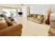 Spacious living room bathed in natural light, furnished with comfortable couches and opening to a patio at 4333 Baden Dr, Holiday, FL 34691