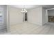 Dining room with decorative chandelier and tile flooring at 4369 Marine Pkwy, New Port Richey, FL 34652