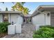The front entrance features a brick pathway, decorative plantings, and a covered entrance at 4369 Marine Pkwy, New Port Richey, FL 34652