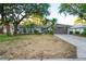 Charming single-story home featuring mature trees, well-kept landscaping, and a two-car garage at 4369 Marine Pkwy, New Port Richey, FL 34652
