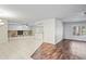 Open living space with a stone fireplace and tile flooring throughout at 4369 Marine Pkwy, New Port Richey, FL 34652