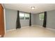 Spacious bedroom with neutral walls and large windows that offer plenty of natural light at 5018 Sherwood Dr, New Port Richey, FL 34652