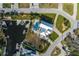 Aerial view of waterfront property with a pool, boat dock, and lush landscaping at 5040 Waterside Dr, Port Richey, FL 34668