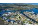 Desirable waterfront property with mature trees offering gorgeous views of the water and surrounding neighborhood at 5040 Waterside Dr, Port Richey, FL 34668