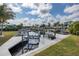 View of a private boat dock and canal featuring a boat lift, surrounded by lush greenery at 5040 Waterside Dr, Port Richey, FL 34668