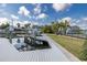 Picture of the dock featuring a boat lift, power lines, palm trees, and water at 5040 Waterside Dr, Port Richey, FL 34668