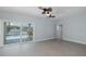 Bright recreation room features a ceiling fan and views of the pool at 5040 Waterside Dr, Port Richey, FL 34668