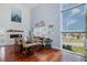Inviting living room offers cherry wood floors, a fireplace, large windows, and views of the surrounding neighborhood at 5040 Waterside Dr, Port Richey, FL 34668