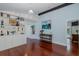 Bright living room boasts cherry wood floors, custom built-in shelving, and a nautical-inspired decor at 5040 Waterside Dr, Port Richey, FL 34668