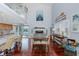 Spacious living room features high ceilings, cherry wood floors, a fireplace, and access to an outside balcony at 5040 Waterside Dr, Port Richey, FL 34668