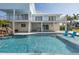 Gorgeous pool area featuring an elevated deck, a waterfall and ample space to entertain at 5040 Waterside Dr, Port Richey, FL 34668