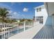 Spacious outdoor porch overlooking the neighborhood, with clear views of the sunny blue sky at 5040 Waterside Dr, Port Richey, FL 34668