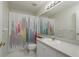 Bathroom featuring a vanity with sink, a mirror, and a shower with a colorful shower curtain at 5931 Precious View Ct, New Port Richey, FL 34655