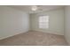 Neutral bedroom featuring carpet, a ceiling fan, and a window with blinds at 5931 Precious View Ct, New Port Richey, FL 34655