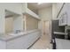 Well-lit kitchen featuring sleek appliances, white cabinetry, and durable countertops at 5931 Precious View Ct, New Port Richey, FL 34655
