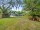 Spacious backyard with a screened in pool at 606 Howell Ave, Brooksville, FL 34601
