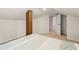This bedroom features neutral carpeting, a closet, and a bright window at 606 Howell Ave, Brooksville, FL 34601