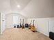 This bonus room features neutral carpeting, a bright window, and several guitars at 606 Howell Ave, Brooksville, FL 34601