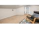 Cozy bonus room featuring neutral carpeting, and a comfortable rocking chair on a decorative rug at 606 Howell Ave, Brooksville, FL 34601
