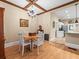 Open concept dining area featuring hardwood floors and an entry to the kitchen at 606 Howell Ave, Brooksville, FL 34601