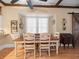 Cozy dining room featuring a wooden table, chairs, and natural light from a nearby window at 606 Howell Ave, Brooksville, FL 34601