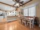 View of eat-in dining area, featuring hardwood floors and view of the kitchen at 606 Howell Ave, Brooksville, FL 34601